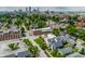 A high-angle showcases the property nestled in a neighborhood with vibrant city views, tree-lined streets, and a classic urban charm at 1610 N Alabama St, Indianapolis, IN 46202