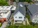 An aerial view of a home with front yard landscaping, inviting entryway, and a modern design nestled in an urban neighborhood at 1610 N Alabama St, Indianapolis, IN 46202