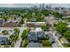 A scenic aerial view of the property within its charming urban neighborhood, complete with tree-lined streets and city skyline views at 1610 N Alabama St, Indianapolis, IN 46202