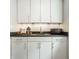 Bar with white cabinets, granite countertop, undermount sink, and stylish decor at 1610 N Alabama St, Indianapolis, IN 46202