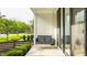 Inviting front porch view featuring a cozy hanging swing and natural light at 1610 N Alabama St, Indianapolis, IN 46202