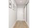 Hallway with hardwood floors and modern sliding barn door at 1610 N Alabama St, Indianapolis, IN 46202
