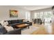 Spacious living room with hardwood floors, a comfortable sectional, and natural light at 1610 N Alabama St, Indianapolis, IN 46202