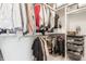 Organized walk-in closet with hanging rods, shelves, and drawers providing ample storage space at 1610 N Alabama St, Indianapolis, IN 46202