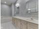 Bathroom featuring dual sinks, a vanity, and a jetted tub at 1645 Oakmere Way, Greenwood, IN 46142