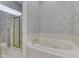 Bathroom with bathtub and walk-in shower at 1645 Oakmere Way, Greenwood, IN 46142