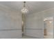 Bedroom with a decorative chandelier, and doorway to a closet and bathroom at 1645 Oakmere Way, Greenwood, IN 46142