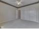 Neutral bedroom features a door to another room, and a double closet at 1645 Oakmere Way, Greenwood, IN 46142