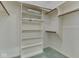 Walk-in closet with built-in shelves and wooden racks at 1645 Oakmere Way, Greenwood, IN 46142