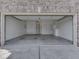 Spacious and clean two-car garage with ample storage cabinets and lighting at 1645 Oakmere Way, Greenwood, IN 46142