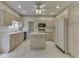 Eat in kitchen featuring an island, white appliances, and a window seat at 1645 Oakmere Way, Greenwood, IN 46142