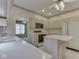 Traditional kitchen with white countertops, cabinetry, and center island at 1645 Oakmere Way, Greenwood, IN 46142