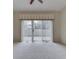 Bright room with sliding glass doors, leading to outdoor patio at 1645 Oakmere Way, Greenwood, IN 46142