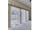 Bright room with sliding glass doors, leading to outdoor patio at 1645 Oakmere Way, Greenwood, IN 46142