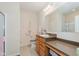 Bathroom with double vanity, light wood cabinets, toilet, and glass shower door at 16573 Grappa Trl, Fishers, IN 46037