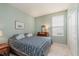 Bedroom featuring green walls, a patterned comforter, dresser, and window at 16573 Grappa Trl, Fishers, IN 46037