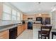 Well-lit kitchen featuring stainless steel appliances, ample counter space and tile flooring at 16573 Grappa Trl, Fishers, IN 46037