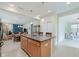 Open-concept kitchen with island seating, modern appliances, and seamlessly connects to other living areas at 16573 Grappa Trl, Fishers, IN 46037