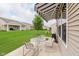 Outdoor patio featuring a grill, table, chairs, and retractable awning providing a perfect spot for entertaining guests at 16573 Grappa Trl, Fishers, IN 46037