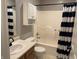 This bathroom includes a tub-shower combo, a vanity, and a toilet, offering essential fixtures in a compact space at 187 Broadmoor Bnd, Pittsboro, IN 46167