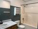 Bathroom featuring a tub-shower combo, vanity, and toilet, creating a functional and clean space for daily routines at 187 Broadmoor Bnd, Pittsboro, IN 46167