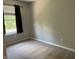 This bedroom features neutral carpeting, light-colored walls, and a window, offering a serene and comfortable living space at 187 Broadmoor Bnd, Pittsboro, IN 46167