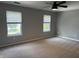 Bedroom showcases a ceiling fan, bright windows, and neutral walls, providing a comfortable and well-lit environment at 187 Broadmoor Bnd, Pittsboro, IN 46167