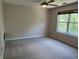 Empty bedroom with neutral paint, carpeting, and natural light from a window at 187 Broadmoor Bnd, Pittsboro, IN 46167