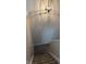 Staircase featuring plush carpeting and a decorative light fixture, creating an inviting and stylish transition between floors at 187 Broadmoor Bnd, Pittsboro, IN 46167