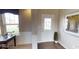 Bright entryway with large window, white trim, wood floors, and a decorative painting at 19824 Atwater Ave, Sheridan, IN 46069