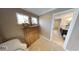 Bedroom featuring a dresser and doorway leading to a bathroom with double sinks and granite countertops at 19824 Atwater Ave, Sheridan, IN 46069