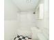 A bathroom featuring a tub and shower combination, white tile and a black and white checkered floor at 2035 W Kessler Blvd N Dr, Indianapolis, IN 46222