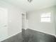 Bedroom featuring neutral walls, wood floor, a ceiling light, and closet at 2035 W Kessler Blvd N Dr, Indianapolis, IN 46222