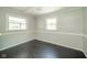 Bright dining room featuring fresh paint, wood floors, ample windows, and plenty of sunlight at 2035 W Kessler Blvd N Dr, Indianapolis, IN 46222