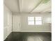 Bright living room featuring white trim, fresh paint, wood floors, and lots of natural light at 2035 W Kessler Blvd N Dr, Indianapolis, IN 46222