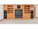 Basement wall with built-in shelving, cabinetry, and speaker system at 2320 Whispering Way, Indianapolis, IN 46239