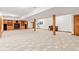 Open basement area with carpet flooring, wooden support beams, and ample space at 2320 Whispering Way, Indianapolis, IN 46239