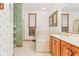 Bathroom showcasing a soaking tub, glass shower, and dual sink vanity at 2320 Whispering Way, Indianapolis, IN 46239