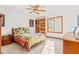 Inviting bedroom with a cozy bed, natural light, and a built-in bookshelf at 2320 Whispering Way, Indianapolis, IN 46239