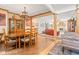 Elegant dining room with hardwood floors, chandelier, and open view to the living room at 2320 Whispering Way, Indianapolis, IN 46239