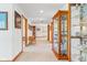 Spacious hallway with display cases and lots of natural light at 2320 Whispering Way, Indianapolis, IN 46239