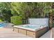 Inviting hot tub surrounded by mature trees, creating a private and relaxing backyard oasis at 2320 Whispering Way, Indianapolis, IN 46239