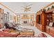 Cozy living room featuring a fireplace, large windows, and comfortable seating area at 2320 Whispering Way, Indianapolis, IN 46239