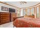 Main bedroom with a TV, balcony access, and large windows for lots of light at 2320 Whispering Way, Indianapolis, IN 46239