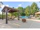 Spacious patio area with outdoor seating, pergola, and fire pit at 2320 Whispering Way, Indianapolis, IN 46239
