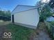 Backyard features a single detached garage with vinyl siding and a chain link fence at 2914 Baltimore Ave, Indianapolis, IN 46218