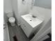 Bathroom features a white sink with cabinet below and a standard toilet at 2914 Baltimore Ave, Indianapolis, IN 46218