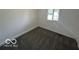 Cozy bedroom with neutral carpeting and a bright window at 2914 Baltimore Ave, Indianapolis, IN 46218