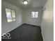 Bright bedroom with neutral carpet and plenty of natural light at 2914 Baltimore Ave, Indianapolis, IN 46218