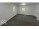 Spacious bedroom with neutral carpet and natural light from two windows at 2914 Baltimore Ave, Indianapolis, IN 46218